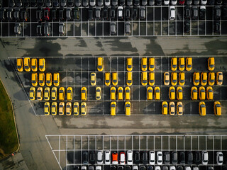 Parking of yellow cars in the Parking lot photographed from the air taxi