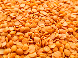 Close up of uncooked red lentils.Food background. Top view, from above.