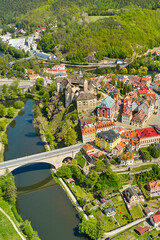 Panoramic view of Loket castle, surrounded by river Ohri and small houses on a river shore, Czech...
