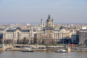 Fototapeta na wymiar Gresham Palace with St. Stephen's Basilica on Danube riverside in Budapest winter morning