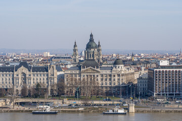 Fototapeta na wymiar Gresham Palace with St. Stephen's Basilica on Danube riverside in Budapest winter morning