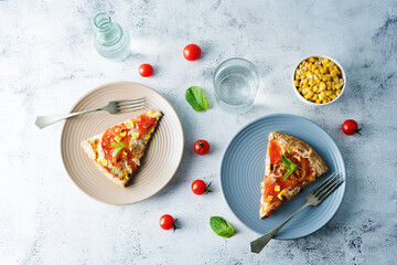 Onion tomato cream cheese whole grain galette in a plate