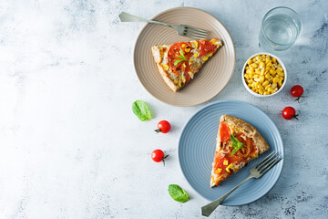 Onion tomato cream cheese whole grain galette in a plate