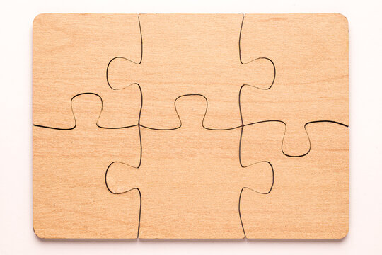 Six elements of a wooden puzzle connected.