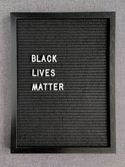 Black letter board with BLACK LIVES MATTERS white title on it.