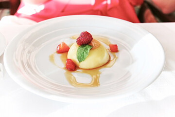 Tasty raspberry Panna Cotta with sweet sauce 