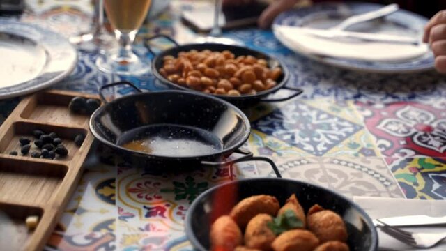 Grilled chorizo, tremocos and cod pasties in a Traditional Portuguese Restaurant