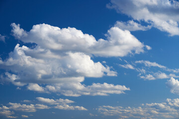 Bright beautiful blue sky with soft clouds, bright sunny day
