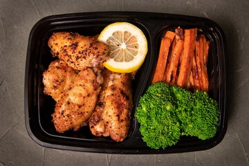 grilled chicken wings with vegetables ready to go