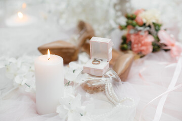 Wedding rings and other accessories close-up during the bride's gathering. Wedding