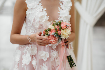 Beautiful and sophisticated wedding bouquet close-up holds the bride in her hands. Wedding bouquet