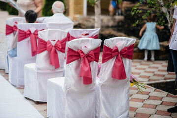 Beautifully decorated and arranged chairs for a festive Banquet. Decor, wedding