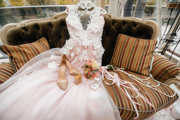 Wedding rings and other accessories close-up during the bride's gathering. Wedding