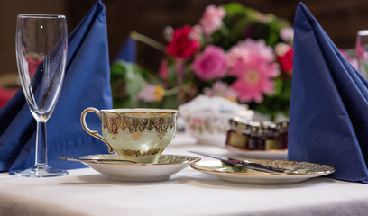 Vintage cup and flowers for afternoon tea
