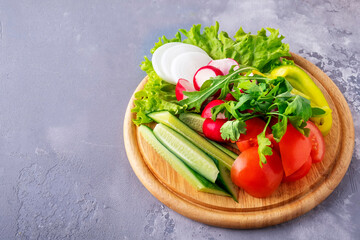Fresh vegetables on a  wooden board. Text space