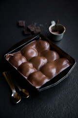 Top View Profiterole on Dark Background.   topped with melted dark chocolate