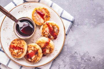 Top view of cottage cheese pancakes with jam. Breakfast concept. Top view, text space