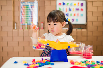 toddler girl play balance toy for homeschooling