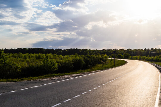 The Sunlit Road Makes A Sharp Turn.