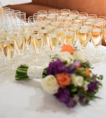 Champagne glasses and flower bouquet