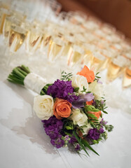 Champagne glasses and flower bouquet