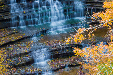 Fall Foliage Over Waterfall in Clifty Creek Park, Southern Indiana - obrazy, fototapety, plakaty