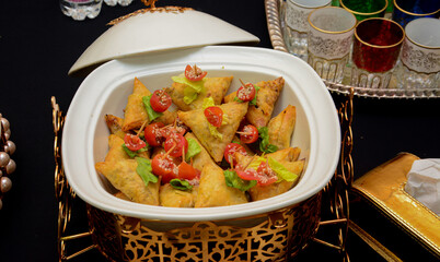 African cuisine: rolls stuffed with minced meat and eggs close-u