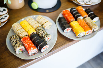 Set sushi with red fish caviar avocado sesame seeds. Delicious Philadelphia Rolls