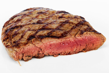 Steak Beef with blood on a white background, selective focus. As backdrop for menus, cookbooks, advertisements and other culinary projects