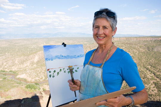 senior woman artist painting landscape, White Rock, New Mexico