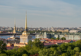 Fototapeta na wymiar Roofs of Saint Petersburg with the Admiralty spire. Winter Palace and Neva.