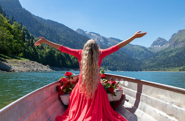 romantic scene with female model with long blond hair on a boat.