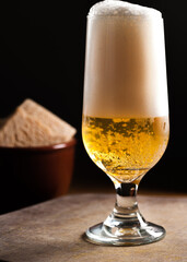 beer in a cup and toasts, selective focus