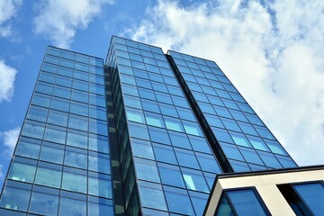 Facade texture of a glass mirrored office building. Fragment of the facade. Modern architecture of the office building.