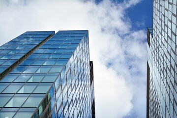 Plakat Facade texture of a glass mirrored office building. Fragment of the facade. Modern architecture of the office building.