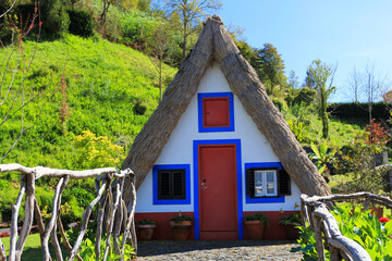 Fototapeta na wymiar SANTANA, MADEIRA, PORTUGAL Traditional Madeira building with thatched roof.