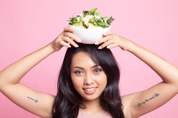 Healthy Asian woman with salad.