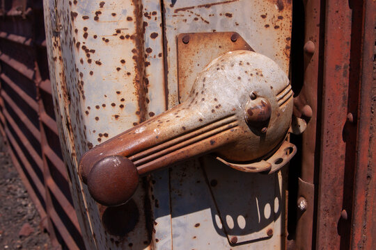 old rusty metal door with crank handle