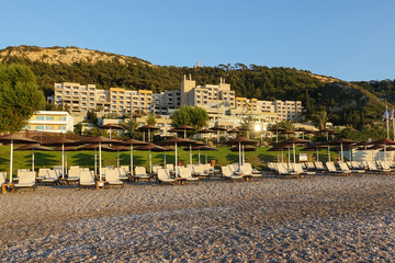 Sun beds and umbrellas on the sea coast.           