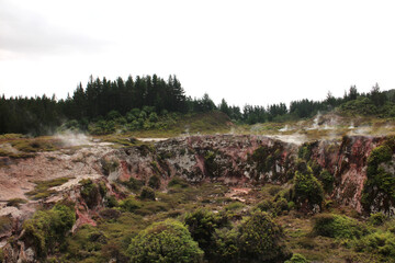 Hot spring and red clay rocks