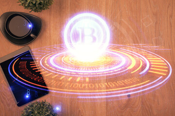 Double exposure of blockchain theme hologram over table with phone. Top view. Crypto technology...