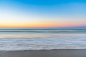 Fototapeta na wymiar Colorful Sunset Horizon and The Beach Sea