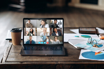 Video conference. Application for remote communication. Screen view of a laptop with people who are...