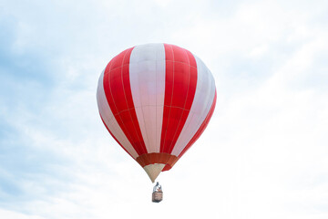 Balloon in the blue sky. Red balloon in the blue cloudy sky.