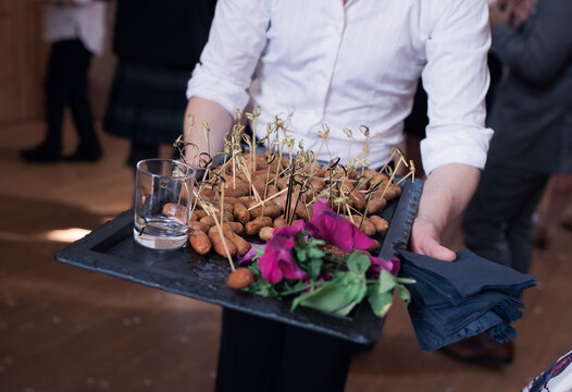 Canapes On A Tray Carried By A Waitress