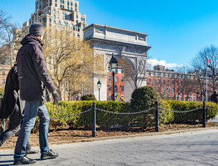 Fototapeta premium New York, NY / United States -JFeb 26, 2016: People walking through Washington Square Park
