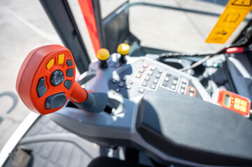 selective focus automatic transmission with armrest and control panel with buttons. switching speeds in the combine. new agricultural machinery © Евгений Вдовин
