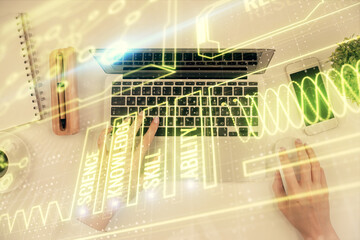 Double exposure of woman hands working on computer and education theme hologram drawing. Top View. Science concept.