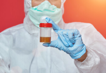 female doctor in a chemical suit. urine analysis is being investigated