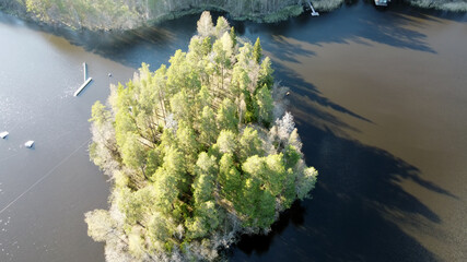 Aerial view of the lake Borisovskoye, the forest and the settlement in autumn day, Borisovo,...
